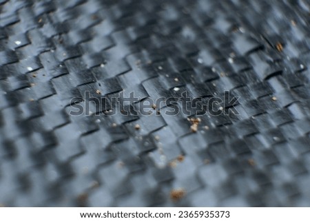 Textured background image with a grid of black overlays.