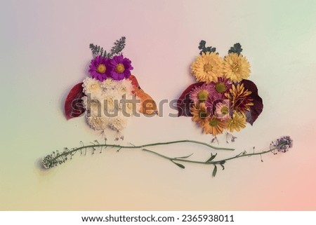 owls made from vivid autumnal leaves and flowers, isolated on white background