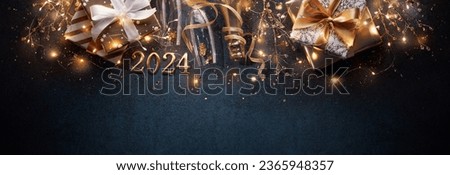 New year 2024 with bright lights,gifts and сhampagne