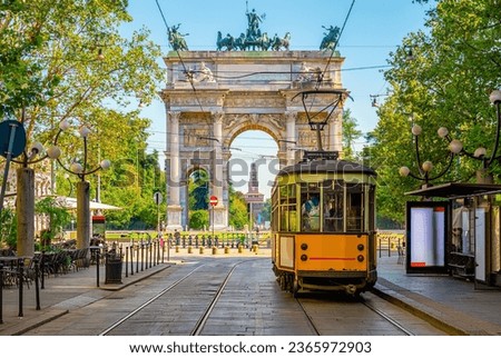 View of the Peace Arch with yellow tram in Milan, Italy Royalty-Free Stock Photo #2365972903