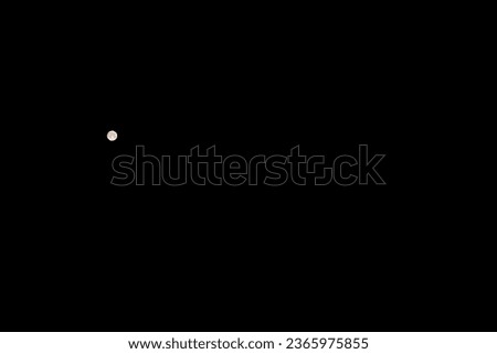 A full moon on a clear night known as The Super Moon seen with a telephoto lens with details on the lunar surface for a presentation background, sci fi design, or Halloween theme with copy space.