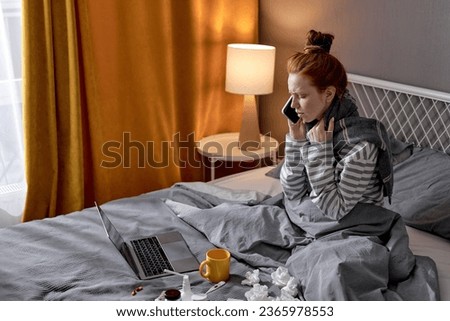 Bad feeling woman lying on bed with phone, calling doctor, ambulance, ginger girl making phone call to friend asking to bring medicine conversation chat talk with family closeup side view portrait Royalty-Free Stock Photo #2365978553