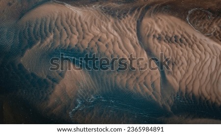 High resolution abstract landscape photo of a tidal waterway in Achill, Ireland.  This unusual image shows the channels and dunes left behind by the ebb and flow of the strong Atlantic tides.
