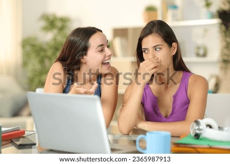 Woman with bad breath talking to friend at home Royalty-Free Stock Photo #2365987913