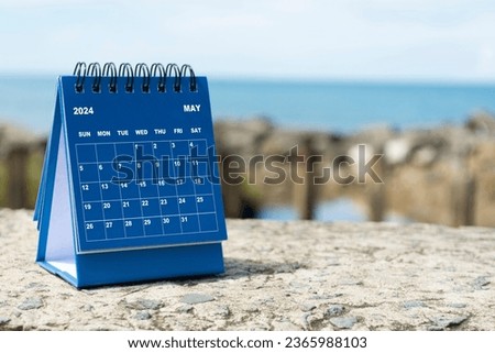 Blue May 2024 calendar on blurred background of blue ocean. 2024 New Year Concept Royalty-Free Stock Photo #2365988103
