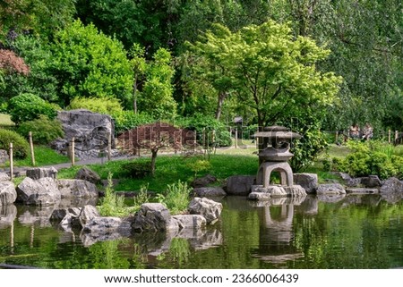 Beautiful traditional Japanese style Garden with a small waterfall, pond and rocks. Summer image of Kioto garden at Holland Park, London