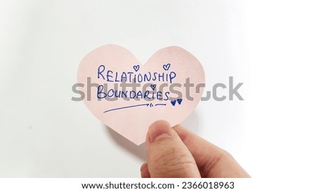 A heart shaped note with the words Relationship Boundaries Royalty-Free Stock Photo #2366018963