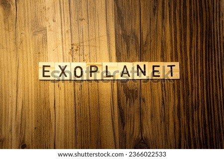 Exoplanet concept word in wooden letters on dark wood background