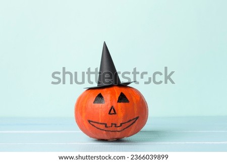 Halloween composition with jack o lanter decor on wooden table