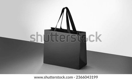 Black paper glossy shopping bag mockup with black handles. Royalty-Free Stock Photo #2366043199