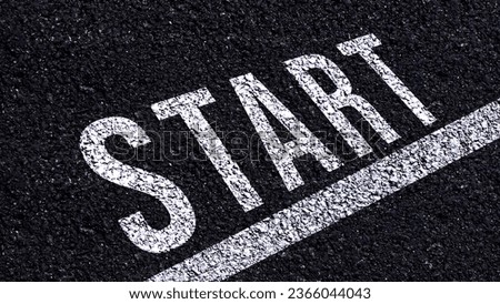 Start text written and line on the road in middle of the asphalt road, Start word on street.