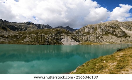 green-blue mountain lake against the backdrop of rocks and mountainous terrain