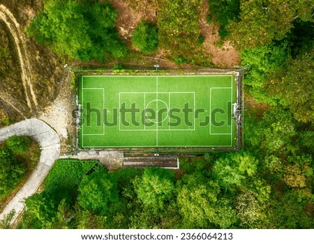 Drone aerial above a football field, located in the forest near the town of Kalofer