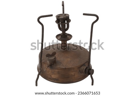 Retro vintage bronze primus stove isolated on white background.