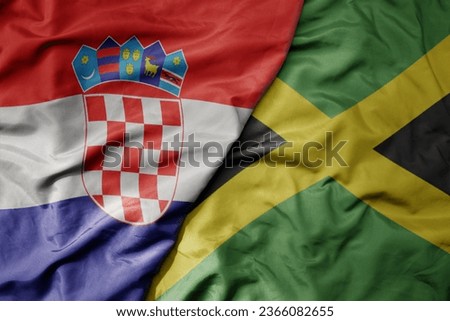 big waving national colorful flag of croatia and national flag of jamaica . macro
