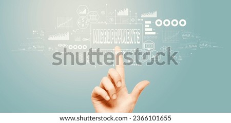 Micropayments theme with hand pressing a button on a technology screen Royalty-Free Stock Photo #2366101655