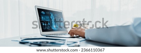 Doctor studying genetic disease in DNA research with laptop, analyze genetic data, formulate medical treatment strategies, and develop healthcare plan for patient with innovative solution. Neoteric Royalty-Free Stock Photo #2366110367