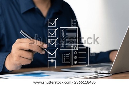 Digital Checklists for efficient business management, Businessman touching marking on checklist guide to paperless assessment and Future Success, Streamlining operations with online surveys. Royalty-Free Stock Photo #2366118485