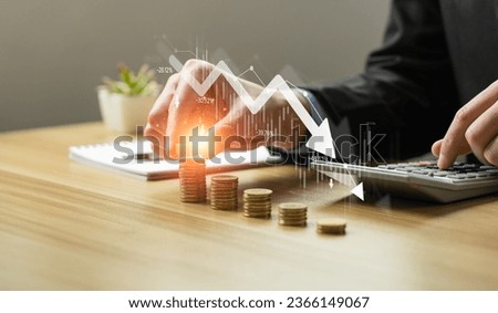 Economic collapse concept, businessman with falling financial graph chart due to global recession. Stock market crash, inflation, financial crisis, Falling income in GDP, capital reduction Royalty-Free Stock Photo #2366149067