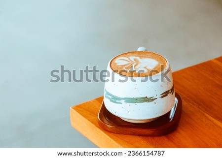 Picture yourself in a cozy cafe, savoring a warm latte.Enjoy the ambiance and snap a photo to capture the aesthetic vibes.Perfect for a weekend treat,looks aesthetic for photo accompanied by typograph