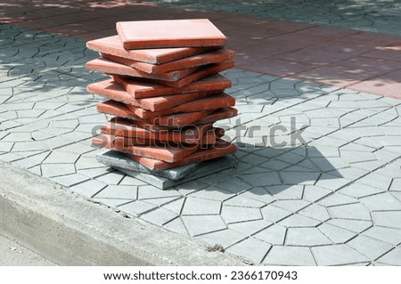 Close up a lot of a pile paving slabs on sidewalk.