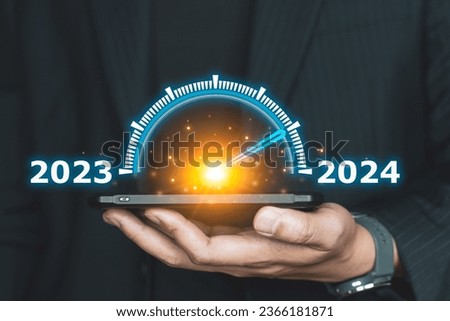 Happy new year 2024, People show pointer indicate 2024 on visual screen. New Goals, Plans, and numbers for Next Year. Businessman growth year 2024. Business Planning and strategy.