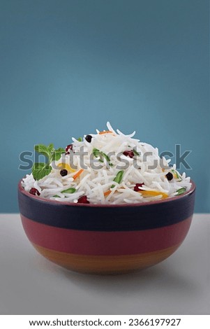 Veg biryani or veg pulav served in a round brass bowl, selective focus, white rice with vegetable Royalty-Free Stock Photo #2366197927