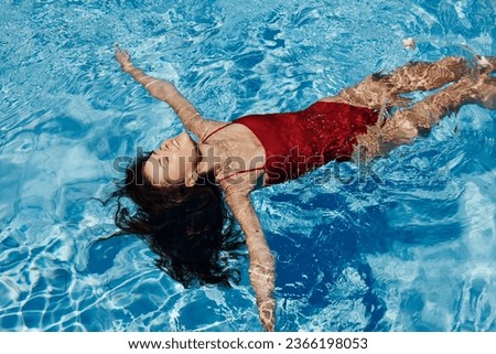 Water woman swim sport pool girl young underwater lifestyle person vacations blue female summer Royalty-Free Stock Photo #2366198053