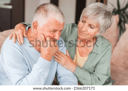 Worried middle aged woman embracing upset old man. Sensitive mature wife showing support, comforting depressed elder husband, experiencing grief