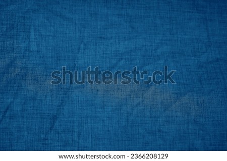 Fabric backdrop blue linen canvas crumpled natural cotton fabric Natural handmade dark linen. top view. surface background Organic Eco textiles White  tissue, woof, cloth cotton texture backdrop.   