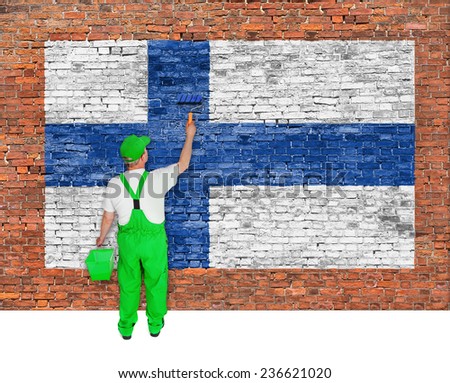 House painter covers brick wall with flag of Finland