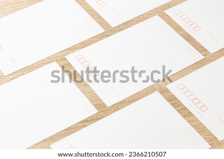 Lots of postcards on the desk. Royalty-Free Stock Photo #2366210507