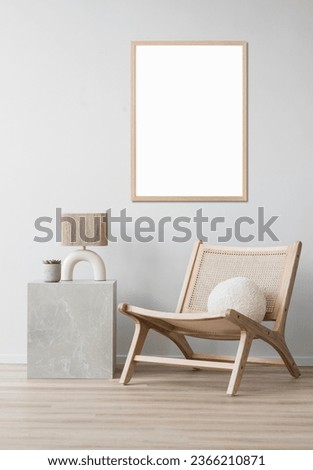 Blank empty picture frame mockup on white wall. Artwork in interior design. Modern boho style interior with poster template