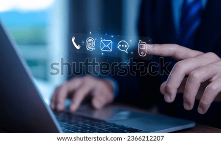 businessman using a laptop to contact customer support shows a contact icon ( address, phone, email, mobile, call ) contact us concept. help from mail websites  digital technology of business service Royalty-Free Stock Photo #2366212207