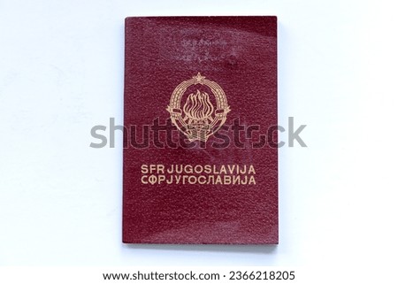 A passport of the former Yugoslavia isolated in white. Royalty-Free Stock Photo #2366218205