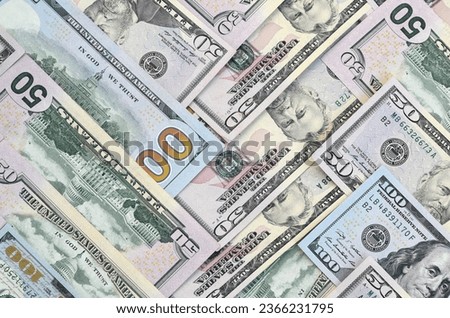 Many one hundred and fifty dollar bills on flat background surface close up. Flat lay top view. Abstract success or business concept