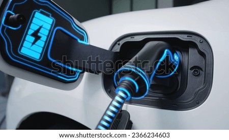 Closeup EV charger from home charging station plugged in and recharging electric car displaying digital battery status hologram. Smart and futuristic home energy infrastructure. Peruse
