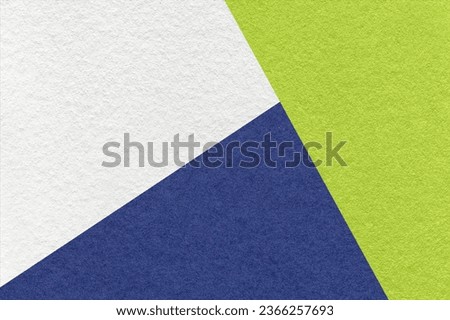 Texture of craft white, green and navy blue shade color paper background, macro. Structure of vintage abstract cardboard with geometric shape and gradient. Felt backdrop closeup.