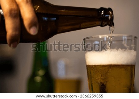 Pouring Beer In Glass, Backgrounds for advertisements and wallpapers in party and drinking scene. Actual images in decorating ideas.