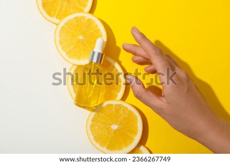 Vitamin C in liquid serum with citrus fruits. Royalty-Free Stock Photo #2366267749