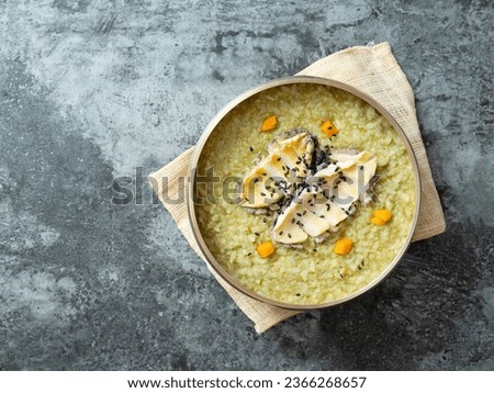 Abalone and Seaweed Rice Porridge Royalty-Free Stock Photo #2366268657