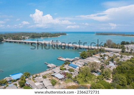 Aerial view of Sarasin Bridge with clear blue turquoise seawater, Andaman sea in Phuket island in summer season, Thailand. Water in ocean material pattern texture wallpaper background.