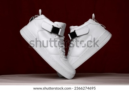 Leather white men's sneakers. Men's casual sports shoes. Fashionable sneakers