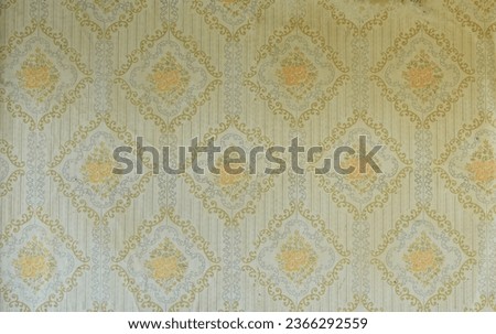 Old wallpaper on the wall. Old wallpaper for texture or background. Royalty-Free Stock Photo #2366292559