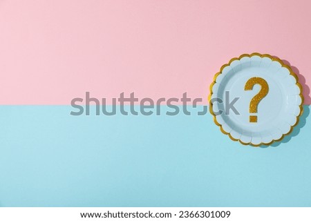 Golden question mark on blue and pink background, space for text