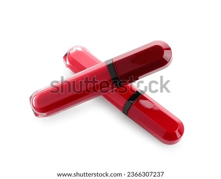 Different new red lipsticks on white background