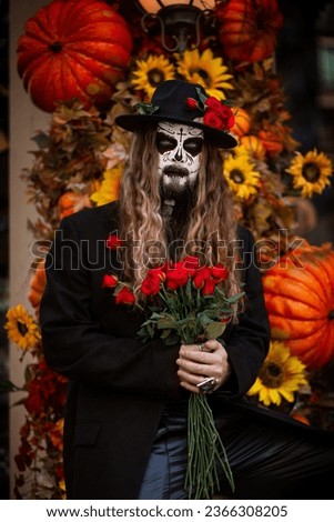 Halloween costume. Mexican style. Skeletons. Man with a hat