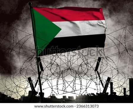Combination of flag of Sudan and barbed wire. Describes Sudan as in a state of war. Sudanese Civil War. Basemap and background concept. Double exposure hologram.         