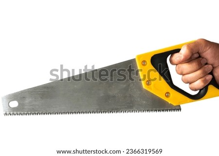a hand holds a saw to cut wood with a white background. Construction topic: hand holding a saw with a black pen on a white background isolated Royalty-Free Stock Photo #2366319569