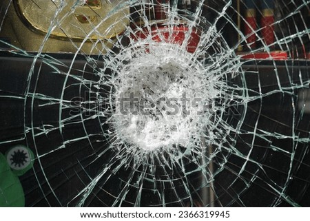 Cracks on the glass, impact on the glass. Broken window